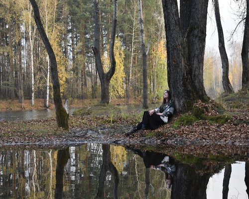 man sitting thoughtfully in nature enjoying mental clarity